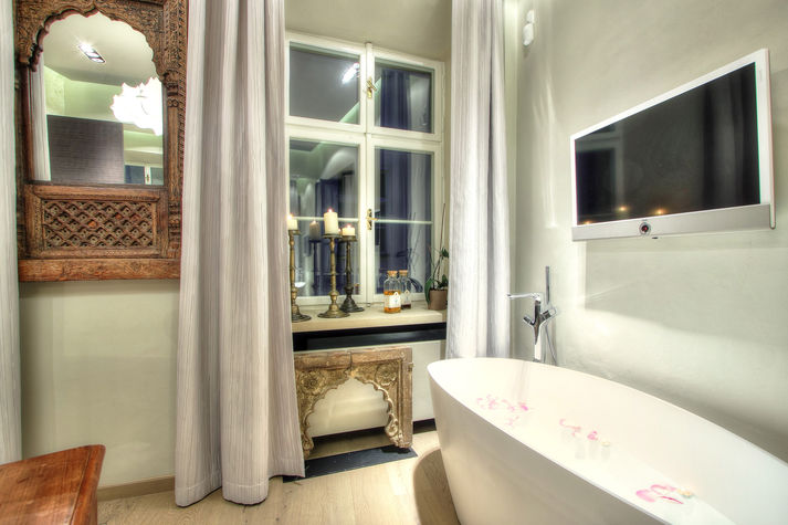 bath tub in the master bedroom with lcd tv