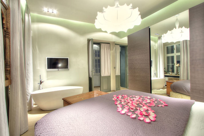 master bedroom with a bathtub
