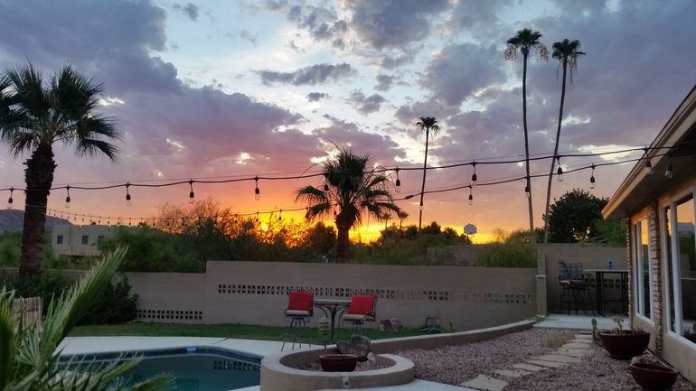 Sunset view of backyard and pool area from bedroom