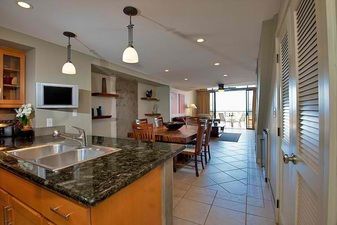 Fully applianced kitchen with flat screen TV