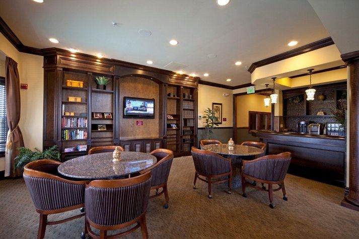Club House with plenty of comfortable seating and flat screen TV