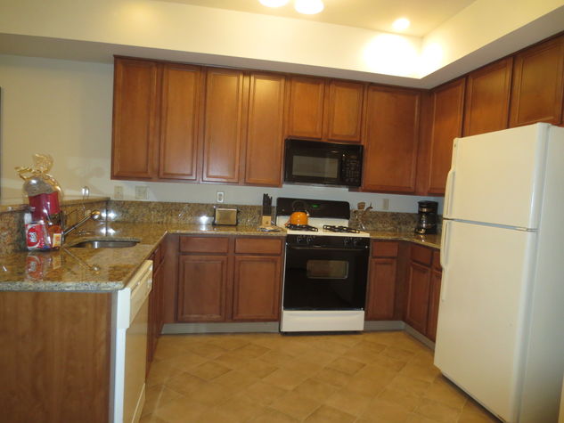 Fully equipped kitchen with full size appliances, pots, pans and dishes