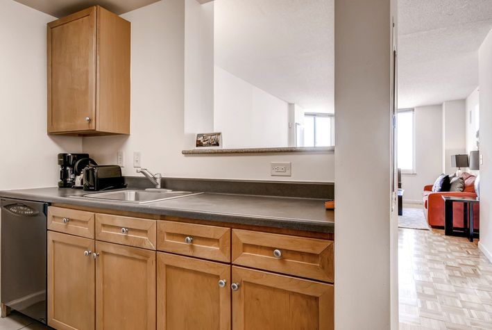 Fully equipped kitchen with convenient pass-through to the dining area