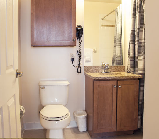 Large bathroom with shower/tub combination; towels and toiletry samples provided