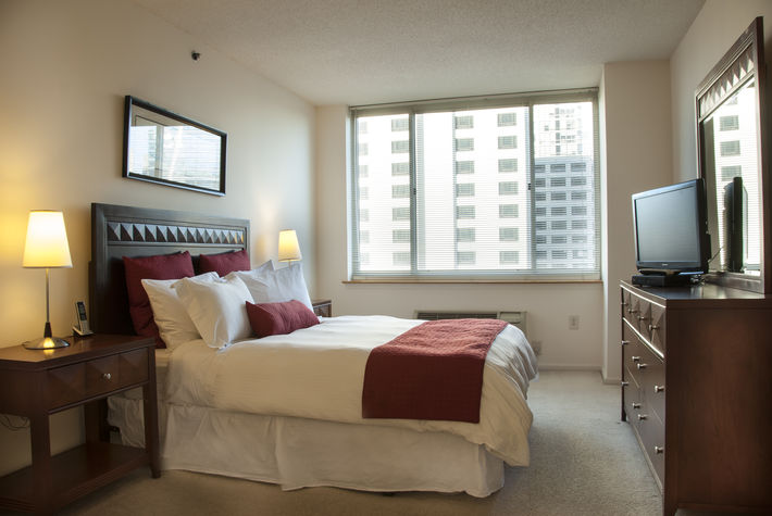 Master bedroom with en-suite bathroom, queen size bed and walk-in closet