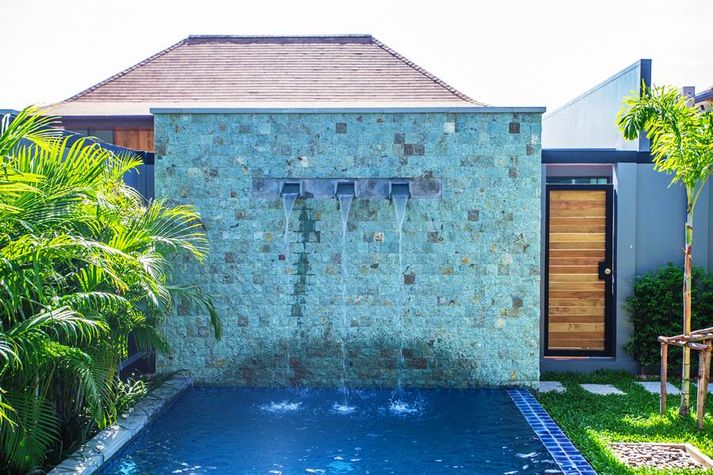 Swimming pool with waterfall