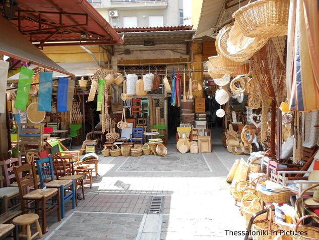 Traditional shops under apartment featuring weaving chair seats with cane, rush, and splints and several handmade ornaments