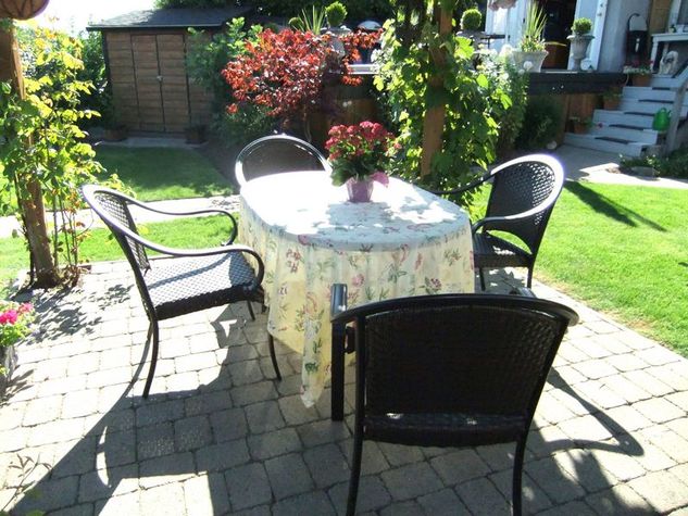 Table and chairs under pergola