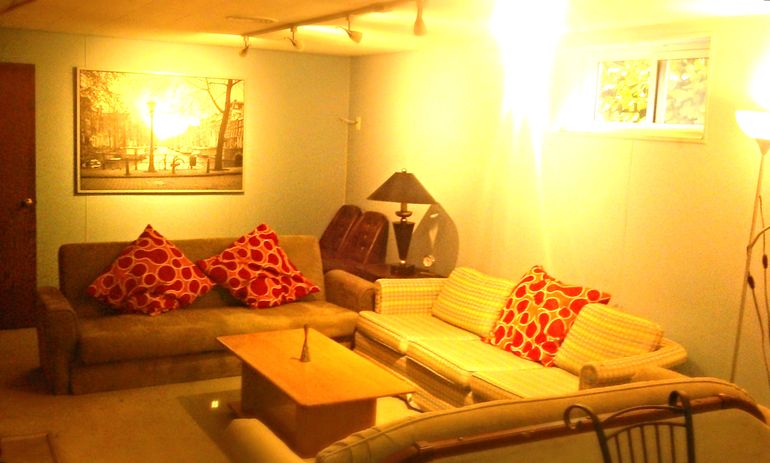 The two beige sofas are hide-a-beds, that could potentially sleep more guests