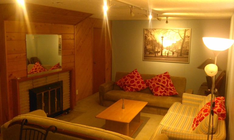 Cozy, spacious, modern living room with wood fireplace