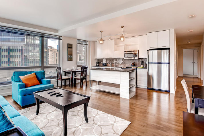Living room with dining area seating three where you can dine in comfort