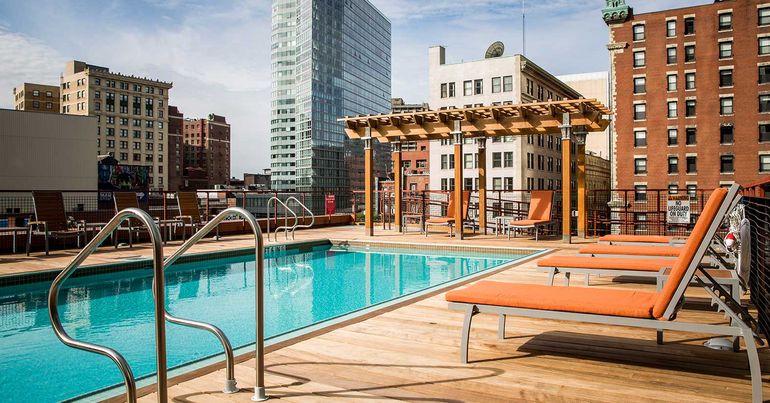Outdoor pool on the rooftop terrace with cabanas