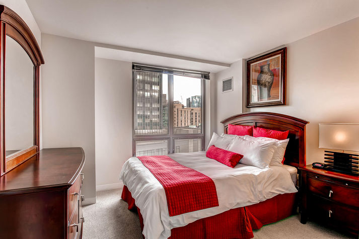 Spacious second bedroom with queen size bed and closet