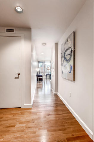 Spacious foyer and hallway leading to the living room