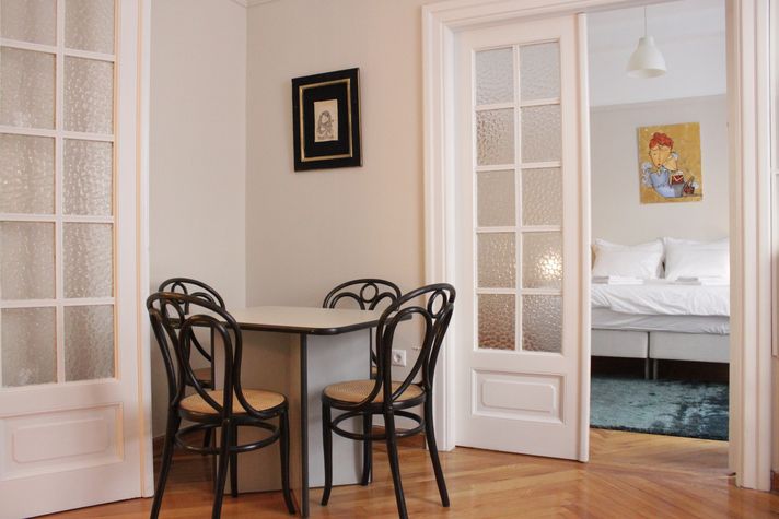 Dining with bedroom in the background