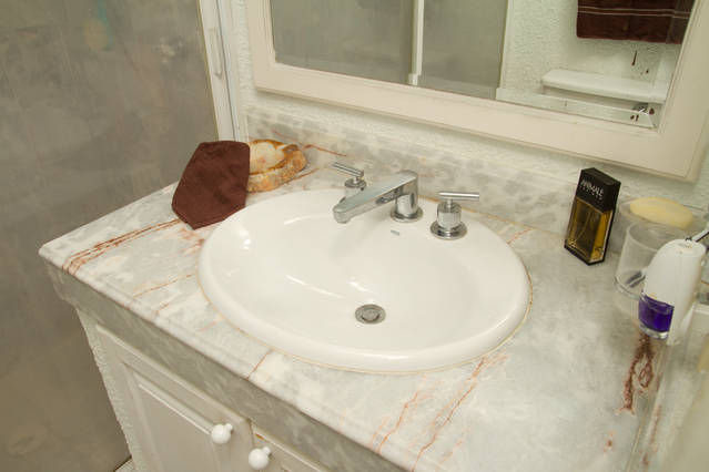 This is the sink of the bathroom in the room. 