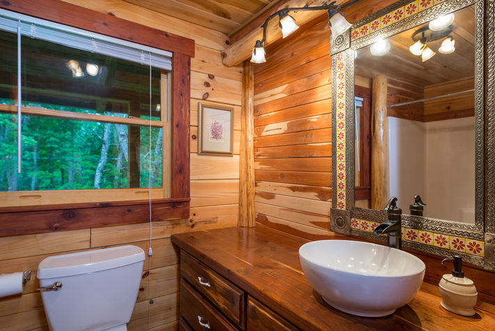 Standard shower/tub combo directly across main floor bedroom