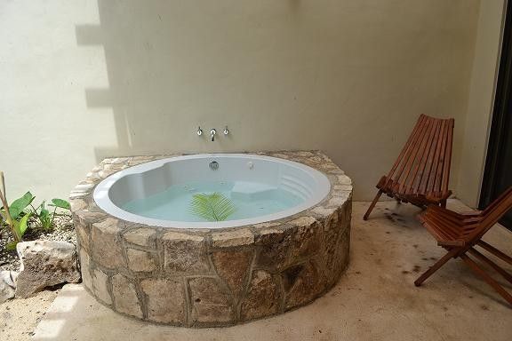 The relaxing terrace is home to a sparkling Jacuzzi
