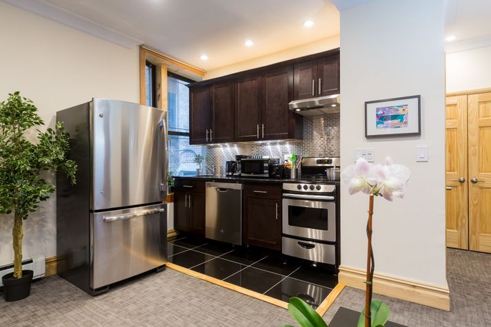 Kitchen with wood cabinets, new appliances and granite countertops