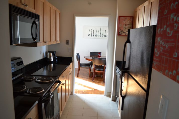 Fully appointed kitchen with granite counters, dishwasher, oven, 4 burner stove, refrigerator / freezer and ice maker - microwave, toaster.