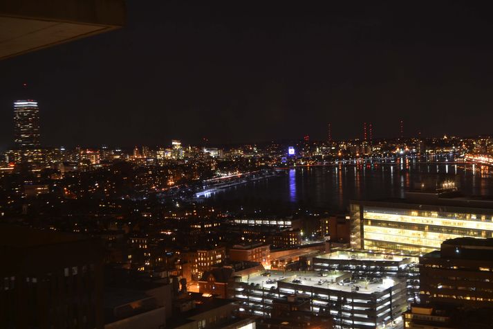At night, view from living room with the Prudential Center, Kenmore Square and the Citgo sign, the Charles River and Cambridge...