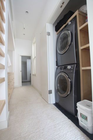 Master bedroom has washer and dryer in closet.