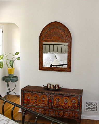 Antique painted moroccan trunk and arched mirror