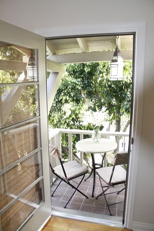 Bistro table and chairs on master bedroom balcony