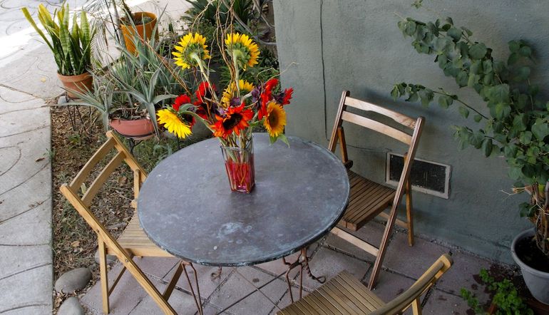 Outdoor dining table and chairs perfect for an al fresco meal, or a glass of wine with friends