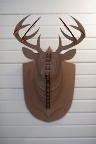 A cardboard deer head that greets you in the entryway