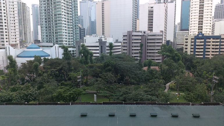 From the balcony you have a view of Sycip park - a rare spot of green in the city.