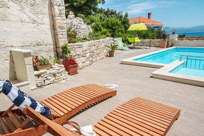 Grab a book and lie down on a deck chair while your kids are playing in the pool