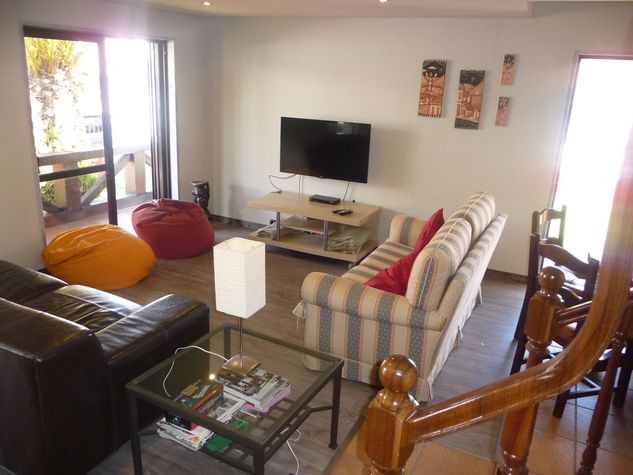 living area with TV Flat screen