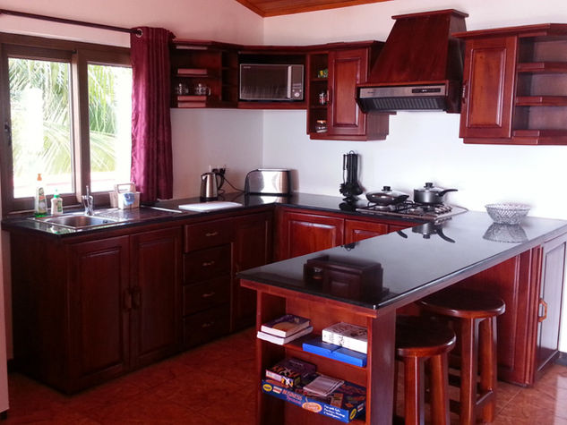 The kitchen inside the upstairs studio apartment