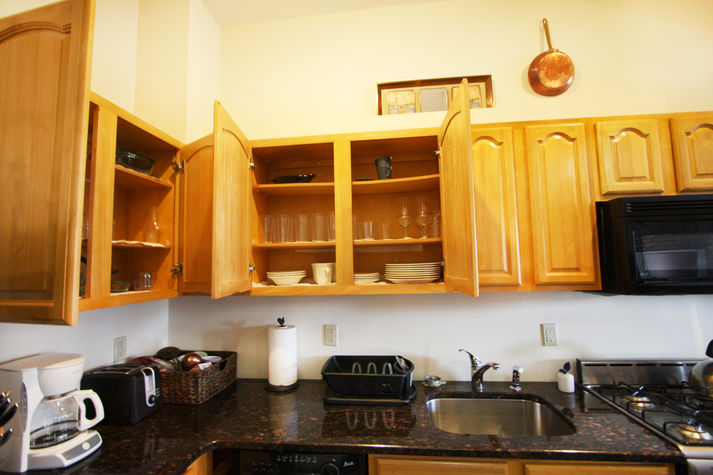 Fully Stocked Kitchen with Cookware, Dishware, and Glassware
