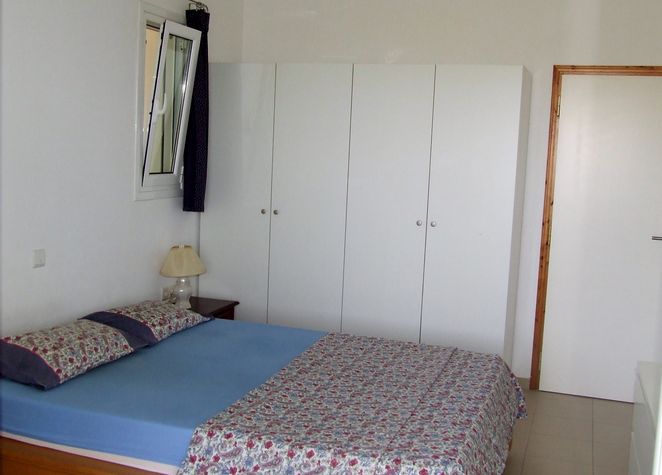 Bedroom 1 with a large double bed and several double wardrobes. Can accommodate a single bed as well