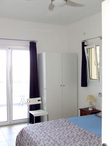 Bedroom 1 with direct access to the Sea facing veranda
