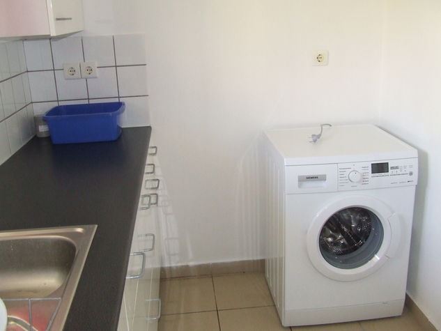 The Utility room with washing machine, microwave oven, dishwasher and other electrical appliances