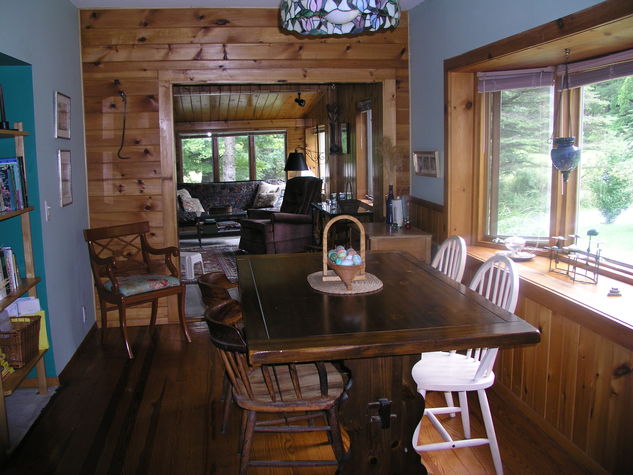 Dining room table seats six, expandable to seating for ten.