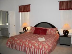 Master bedroom with king bed and en suite bath plus pool access