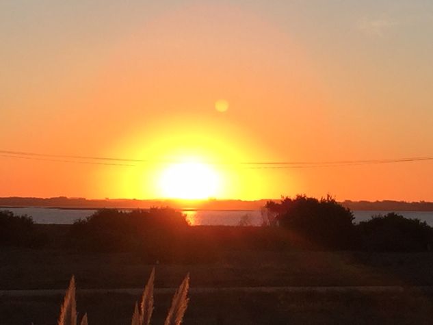 Atardecer desde el deck a la laguna
