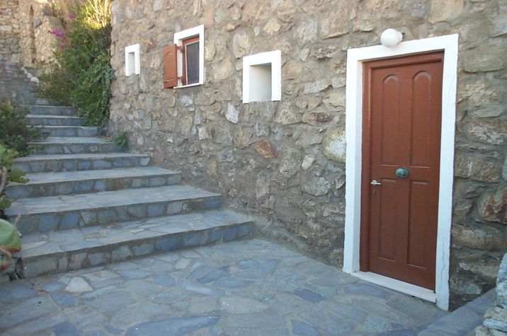 the apartment door and stairs to the street