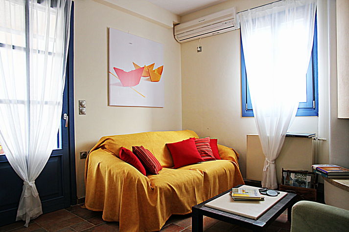 Living Room with couch and door to the outside dining garden area
